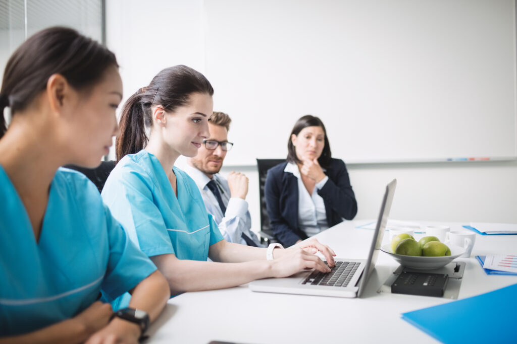 Nurse anesthesia student studying in a clinical setting, preparing for CRNA board certification